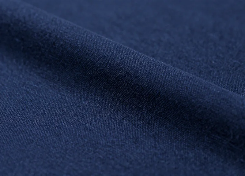 Macro shot of high-quality wool fabric on a premium suit