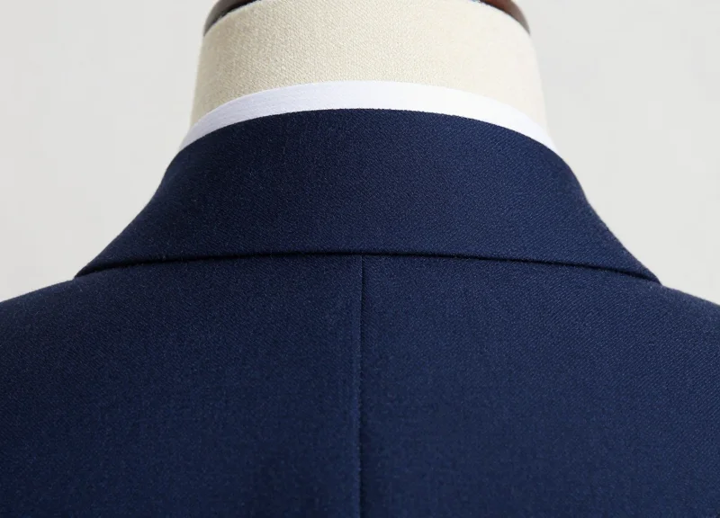 Close-up detail of the underside of a suit collar.