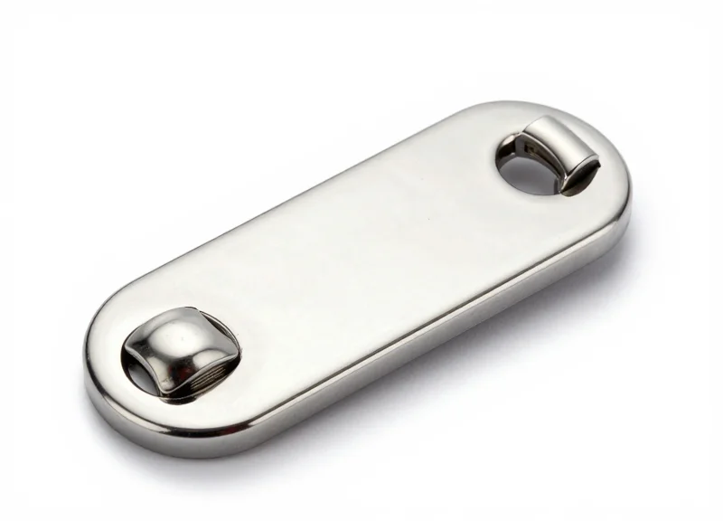 Macro photography of a smooth stainless steel security tag pin and precision clutch.
