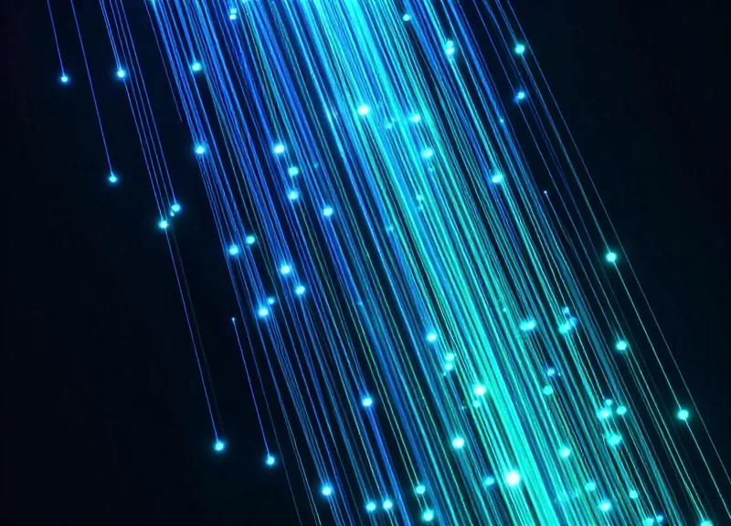 Abstract data visualization showing a downward trend of glowing particles representing a reduction in retail shrinkage.