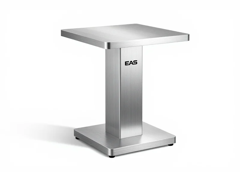 A close-up of a traditional silver EAS security pedestal pillar on a white background.