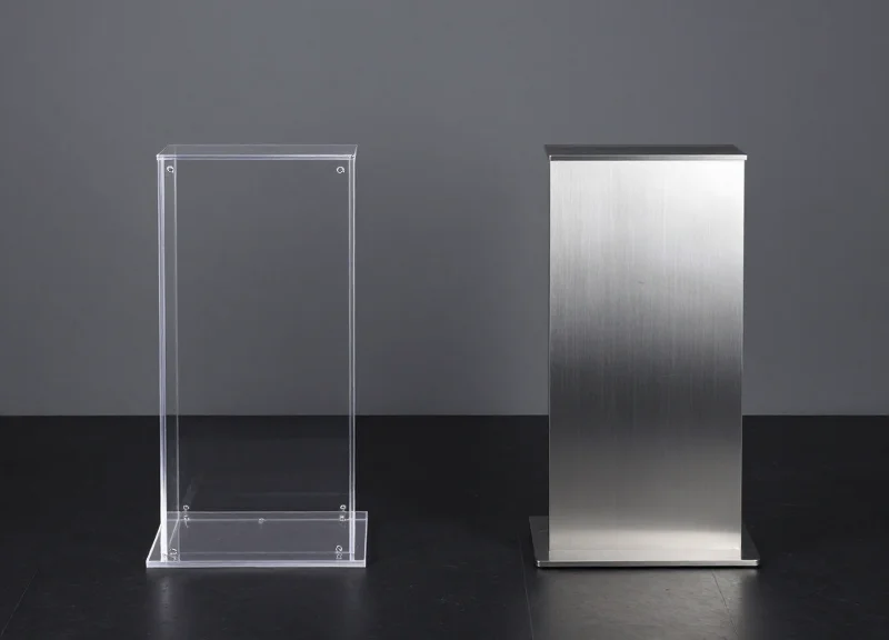 Two different types of EAS security pedestals shown side-by-side for comparison.
