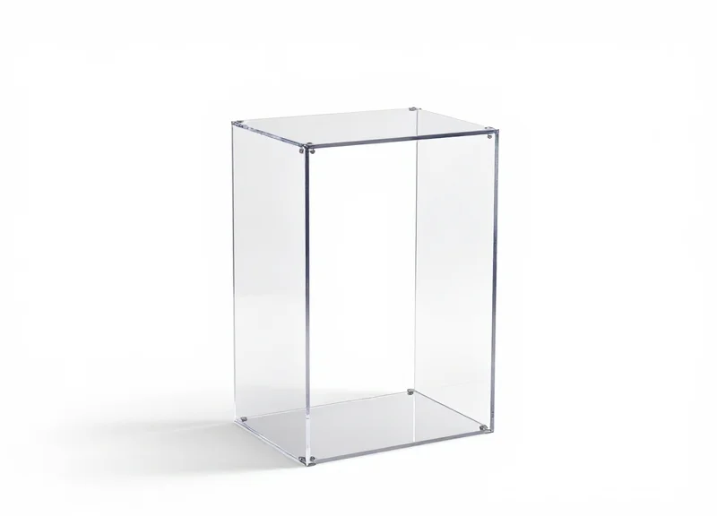 A modern, transparent glass EAS security pedestal used in high-end retail environments.