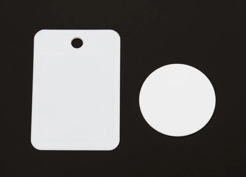 Side-by-side comparison of a hard security tag and a flexible soft label.