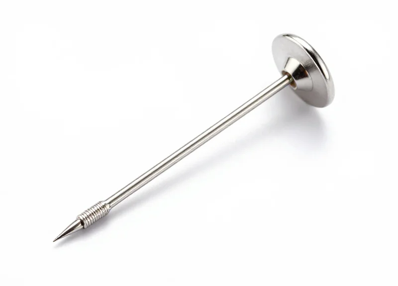 Close-up of a professional fine-gauge security pin for luxury garments