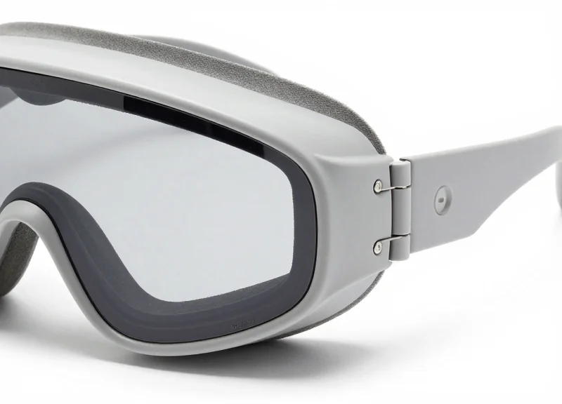 Macro view of high-end designer goggles focusing on the temple hinge area
