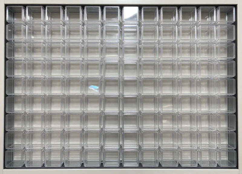 A top-down view of multiple security boxes arranged in a perfect grid for retail display planning.