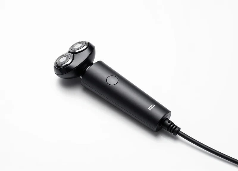A modern electric shaver connected to a sleek, thin Bluetooth-integrated pull-cord on a pure white background.