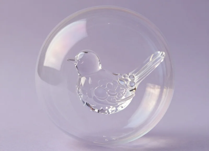Surrealist illustration of a fragile object protected by an invisible shield