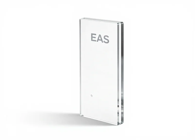 A close-up view of a high-quality clear acrylic EAS antenna showing its transparency and polished edges.