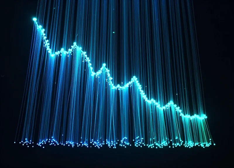 Abstract digital visualization of declining loss and increasing efficiency using glowing light trails.