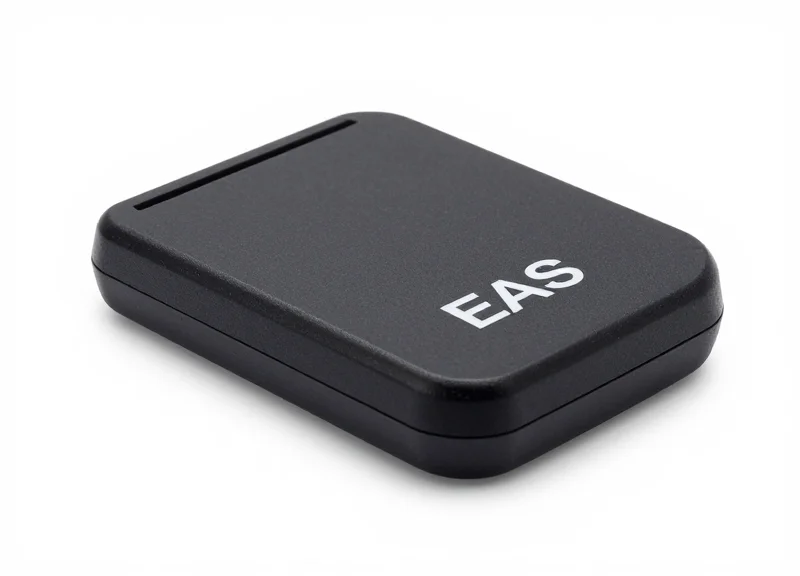 A professional EAS security tag deactivator pad on a workbench.