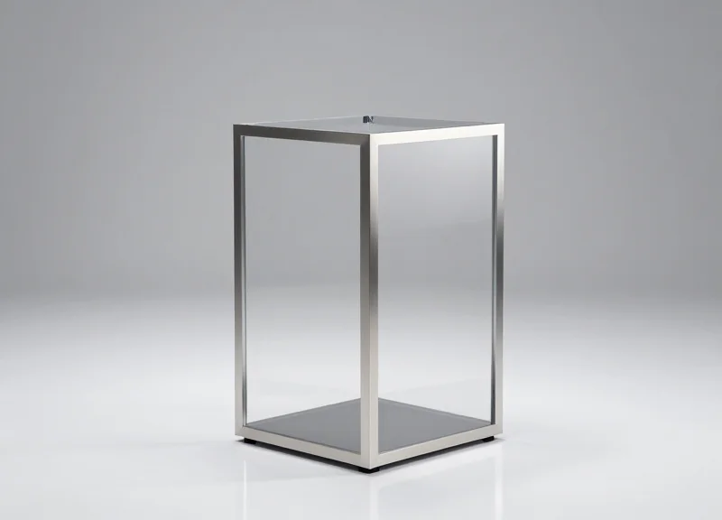 Professional studio shot of a modern, sleek EAS security pedestal with a transparent body.