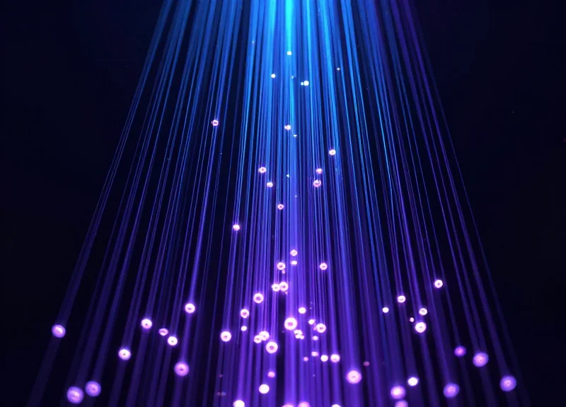 Abstract digital visualization of high-speed bulk data processing with glowing nodes.