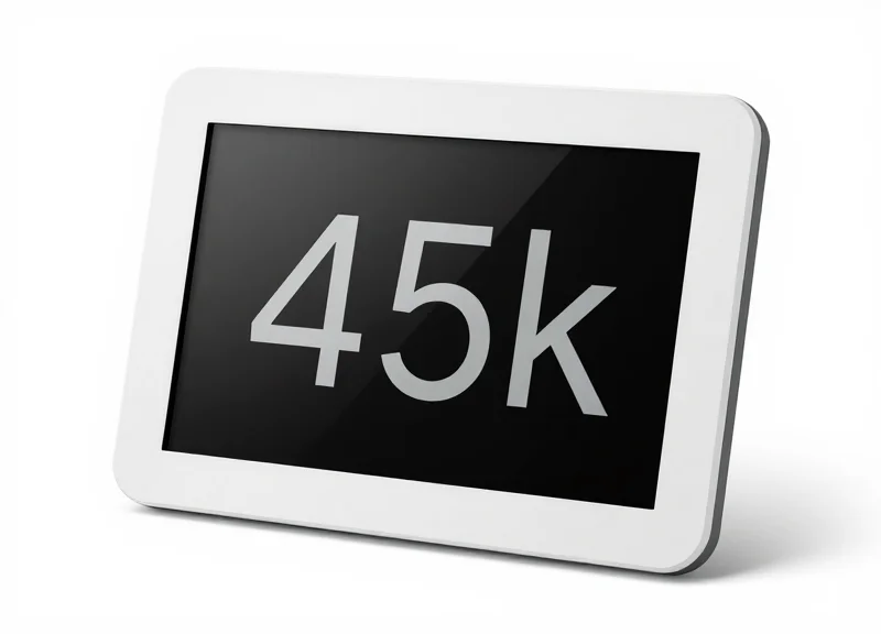 A sleek electronic ink display tag for banking mounted on a polished counter.