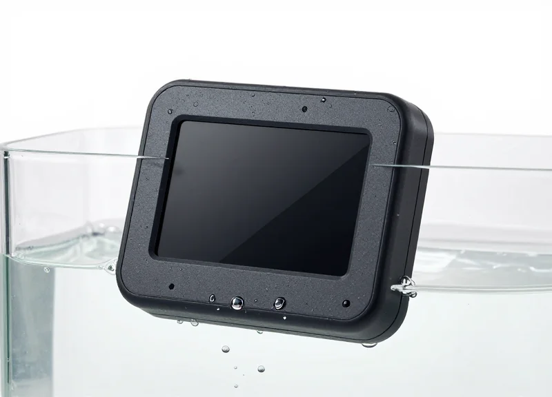 A modern electronic shelf label tag partially submerged in clear water to demonstrate its IP67 rating.