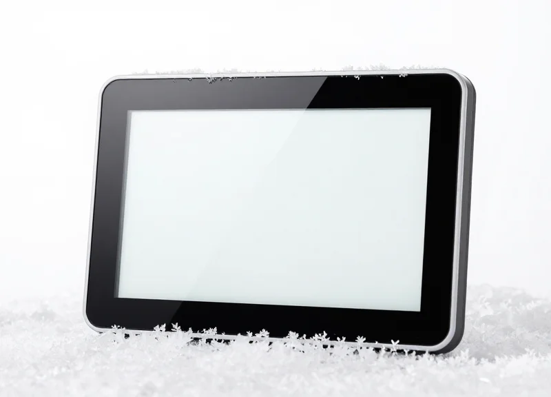 A close-up shot of an electronic shelf label with a perfectly clear display screen despite being surrounded by ice and frost.
