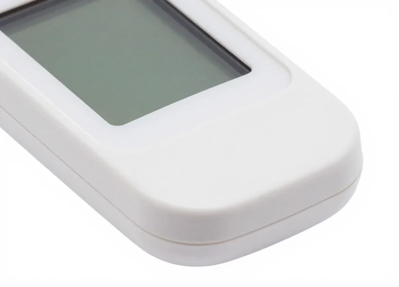 Close-up of an antimicrobial electronic shelf label with a smooth white medical-grade finish